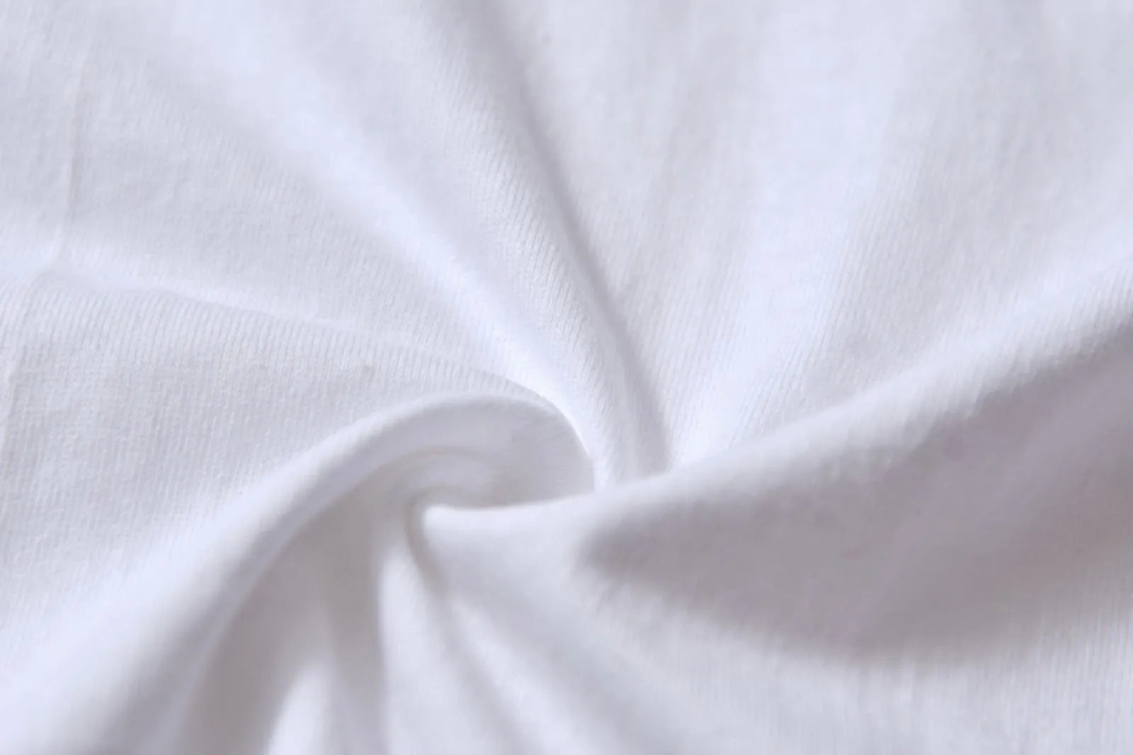 White cotton t-shirt overalls with short sleeves and a loose pullover fit