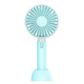 Blue handheld mini electric fan with USB cable, three-speed controls, and oscillation function on desktop
