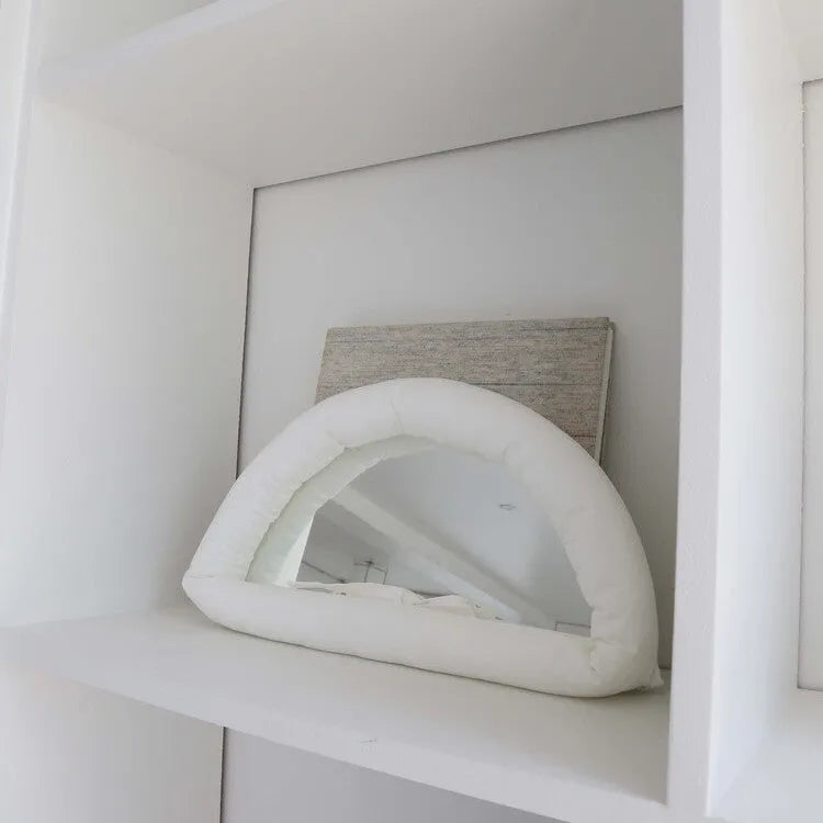Hanging fabric mirror with soft cotton-filled backing in 23x40x5cm size