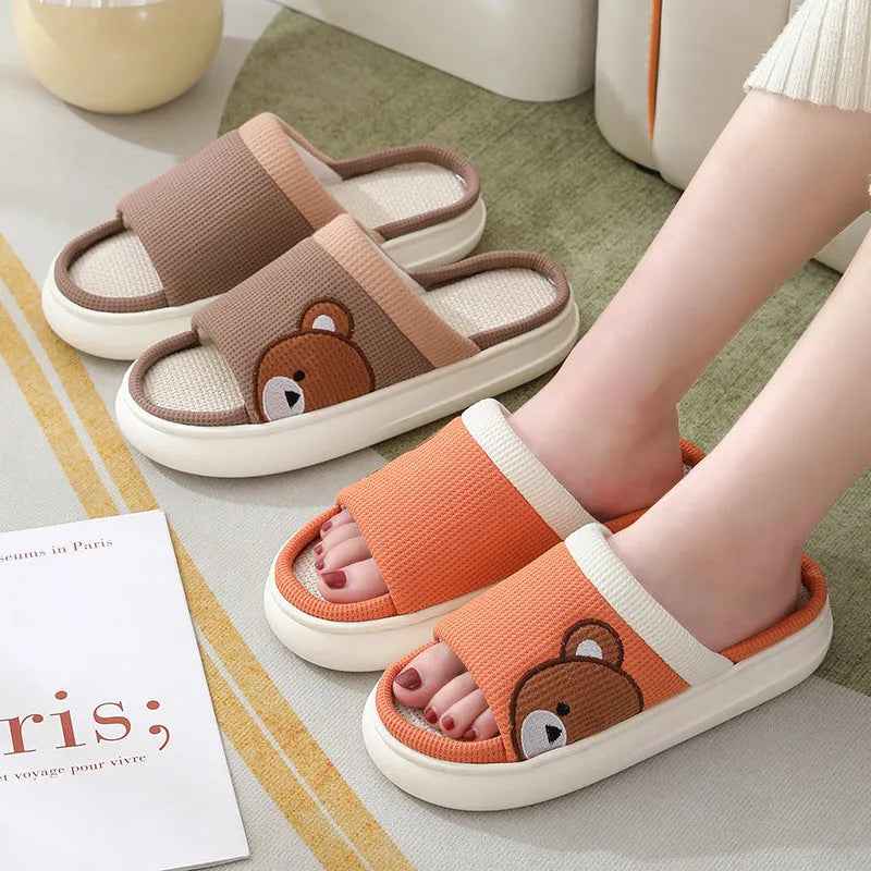 Pair of women's cartoon bear slippers with cotton linen upper and non-slip PVC sole, in light brown colour