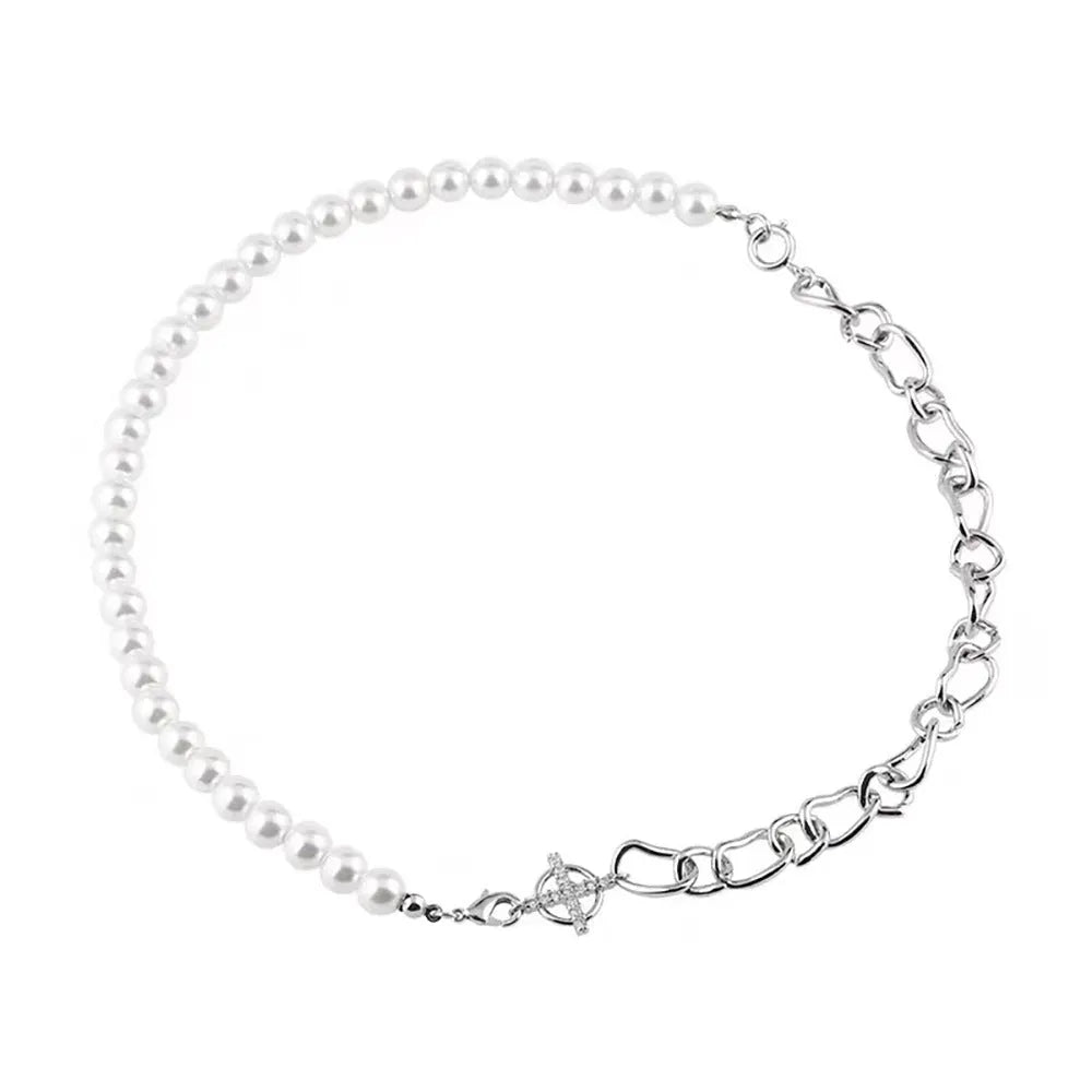 White acrylic geometric asymmetric pendant necklace on a twisted chain, shown at clavicle length.