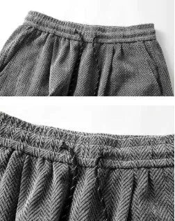 Light grey straight-leg fleece-lined trousers with an elastic waistband on a hanger.