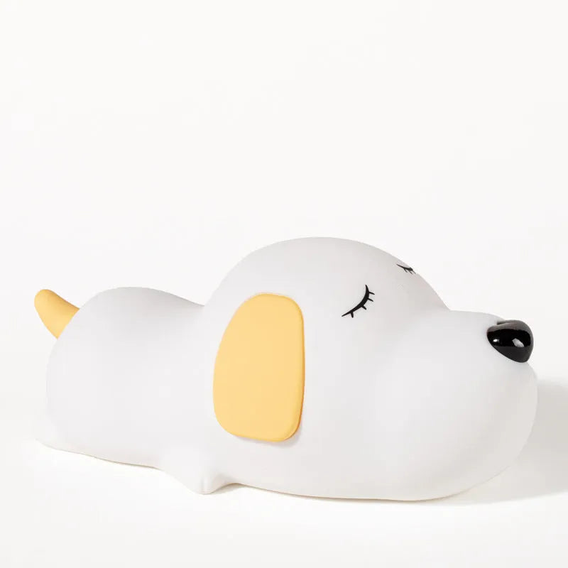Cartoon dog design USB-charging silicone night lamp in two colours on a surface.
