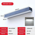 Black solar-powered outdoor wall lamp with IP65 rating for garden installation
