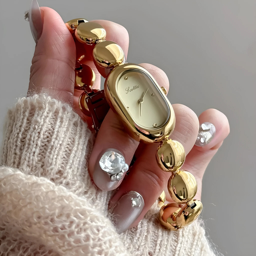 Women's oval fashion watch with slim profile in gold and colour variations