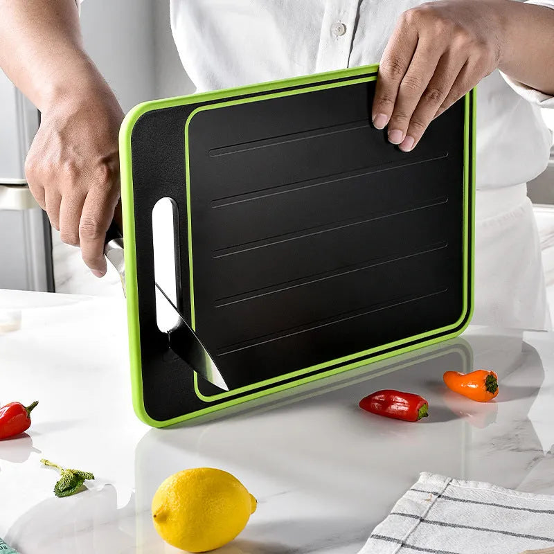 Grey square aluminium kitchen chopping board with double cutting sides, defrosting function and built-in knife sharpener