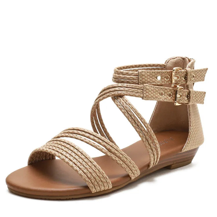 Women's open-toe Roman sandals with cross-strap design, wedge heel, and back zipper in light green.