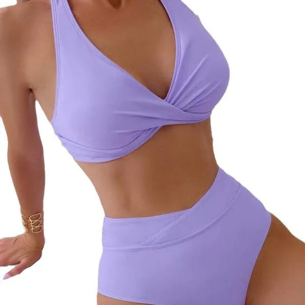 Women's high-waist brief swimsuit in solid colour options of black, green, lavender, peacock green, or blue.