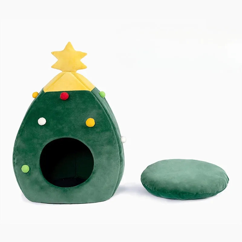 Red Christmas tree shaped plush cave bed for a cat or small dog on a wooden floor