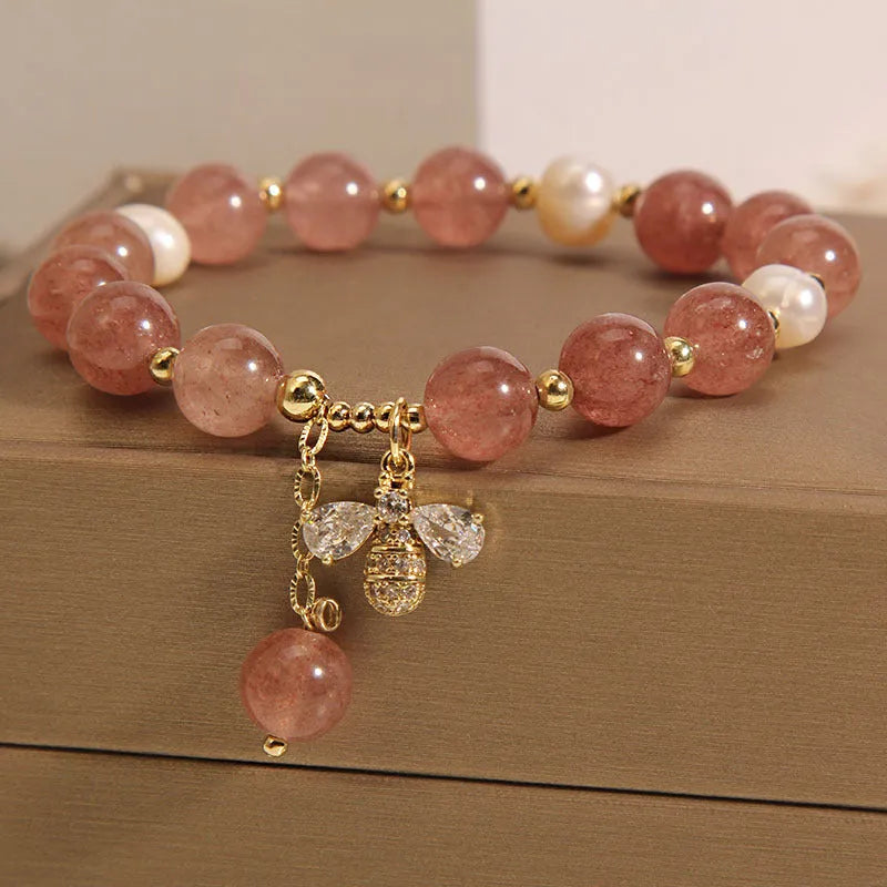 Women's bracelet with strawberry quartz beads, freshwater pearls, zircon details and an alloy clasp