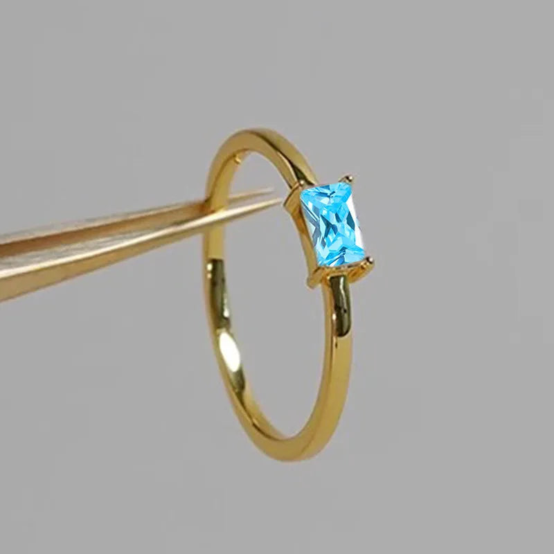 Sapphire blue zircon geometric bracelet ring for women on copper, showing oval and love shapes.
