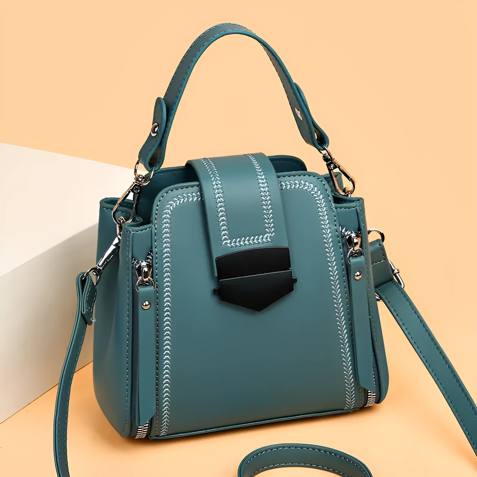 Small square vertical women's handbag in soft textured PU leather, shown in multiple colour options.