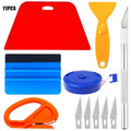 Plastic car window film smoothing tool set with squeegee and scrapers on a white background.