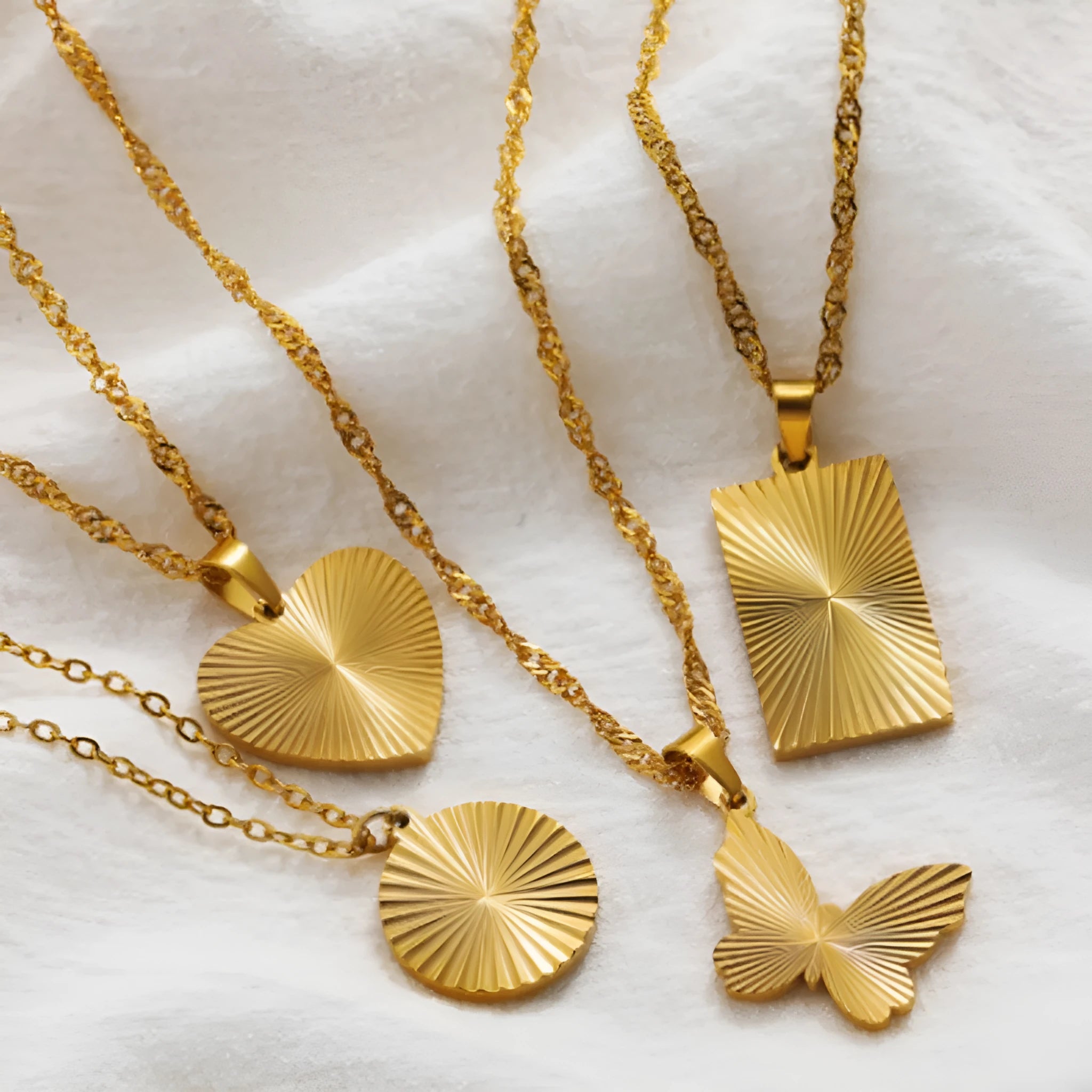 18K real gold plated stainless steel pleated small round pendant necklace on white background