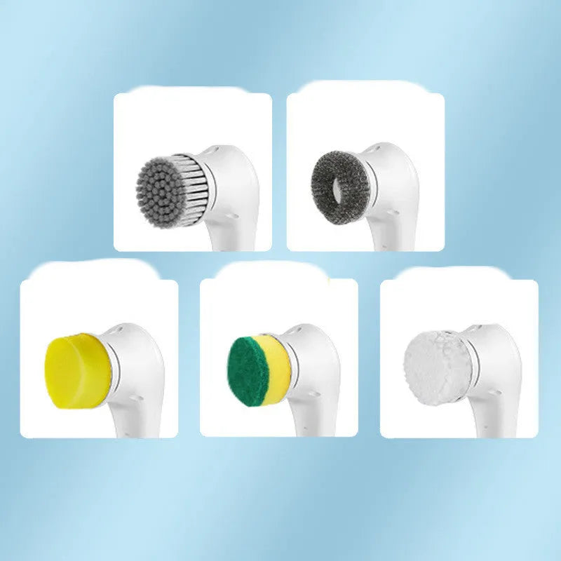 White USB rechargeable cordless electric cleaning brush with five different brush heads on a table.