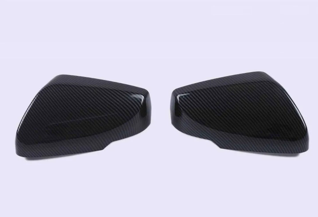 ABS plastic rearview mirror cover for Cadillac CT5 and CT6 models in carbon fibre, silver, or rain frame pattern.