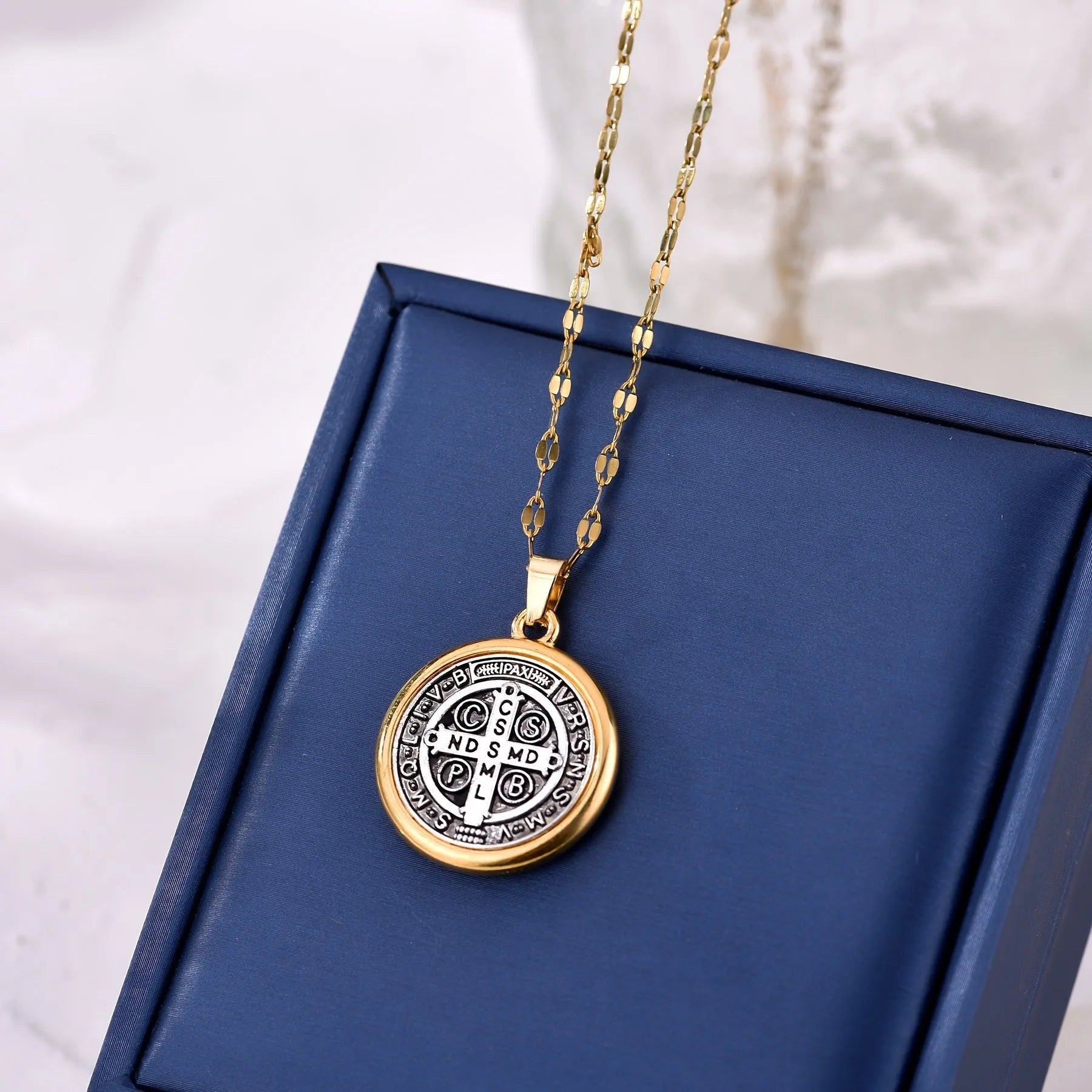 Gold electroplated St. Benedict cross pendant on alloy O-ring chain necklace