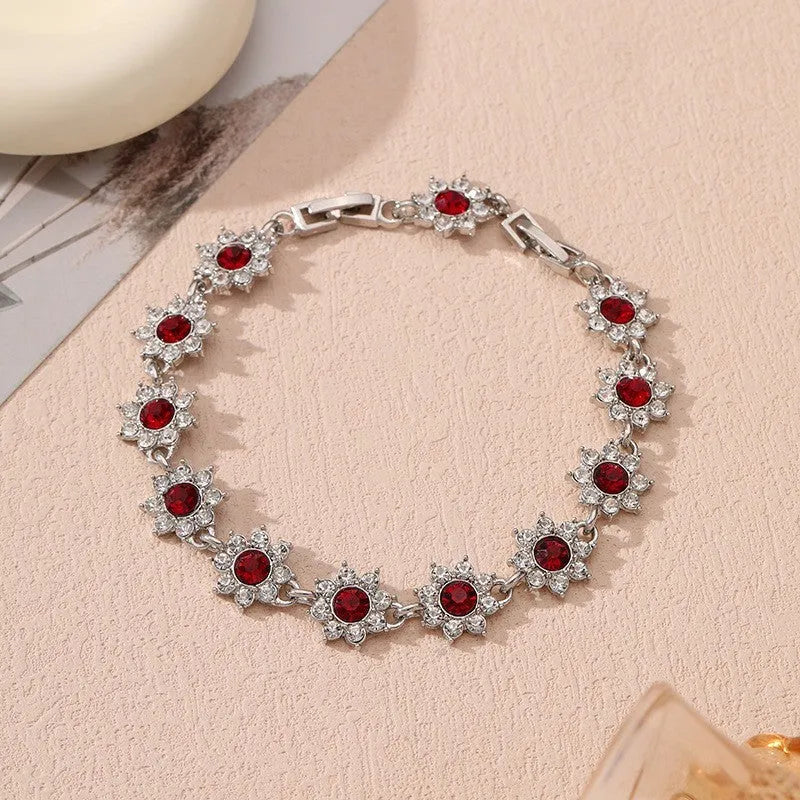 Electroplated zinc alloy flower bracelet with colourful crystal and diamond stones in gold and silver colour finishes