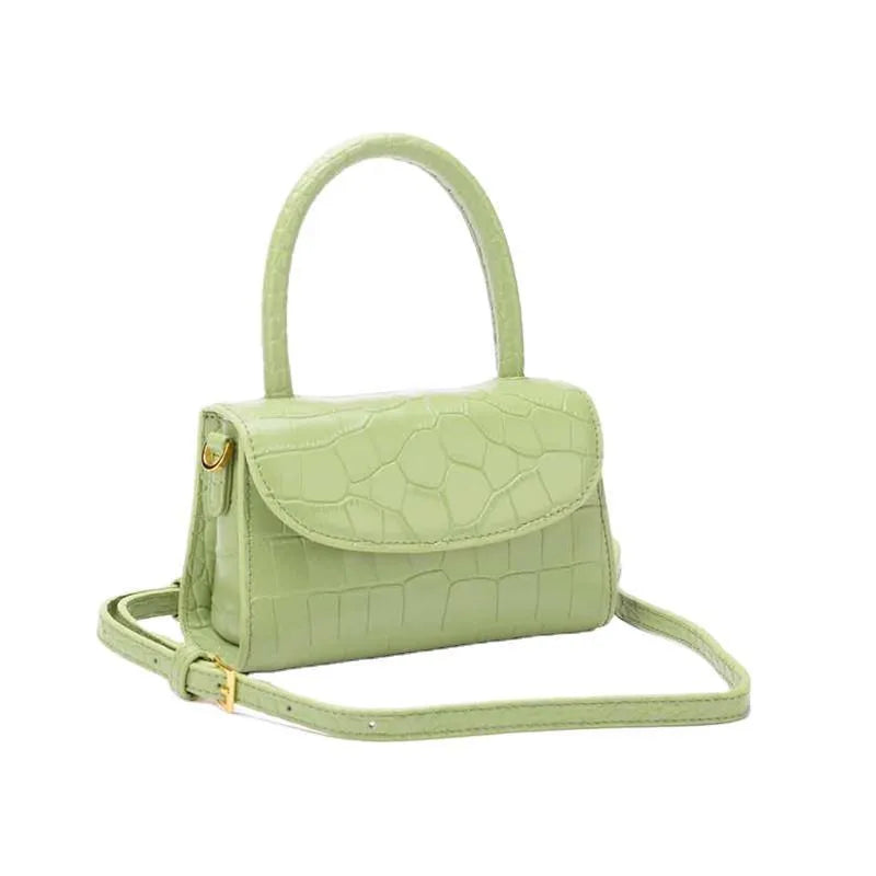 Leather handbag with hard handle, horizontal square shape, 17.5 cm x 7 cm x 11 cm, cover type, in black, blue or light green.