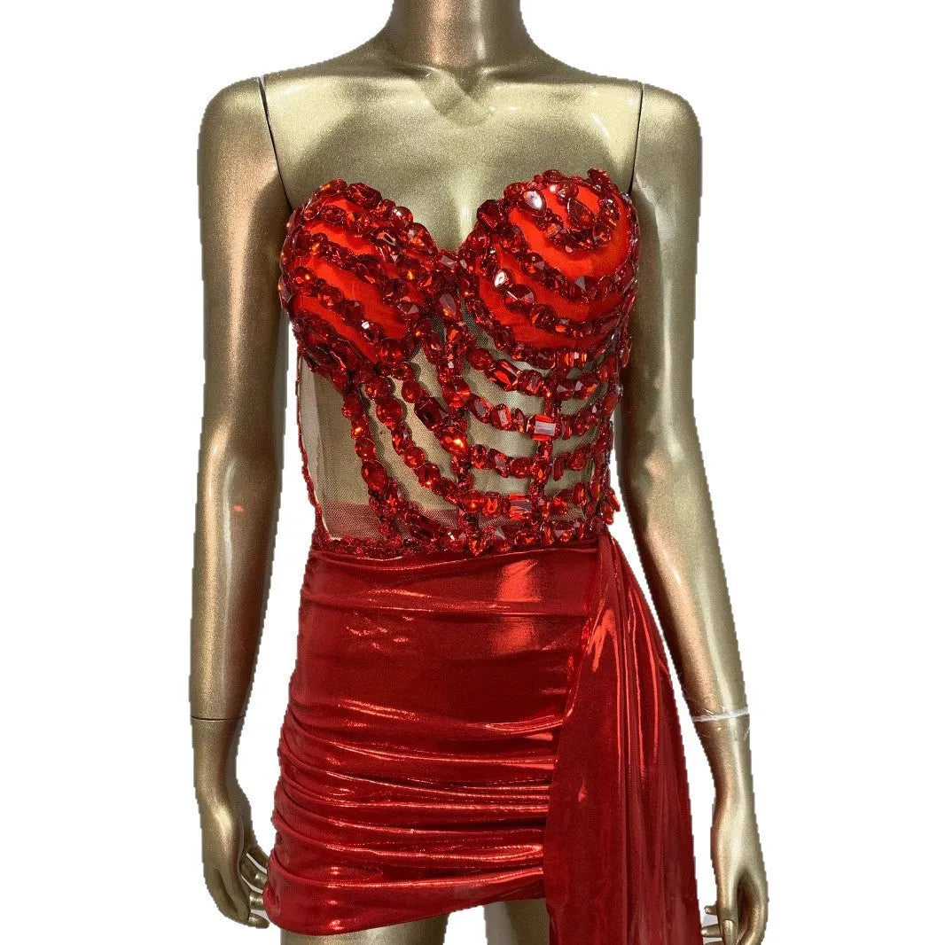 Red two-piece stage costume skirt suit with see-through mesh panels and a form-fitting spandex design.