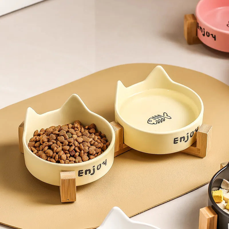 Ceramic cat bowl set with wooden anti-slip frame in cat paw design