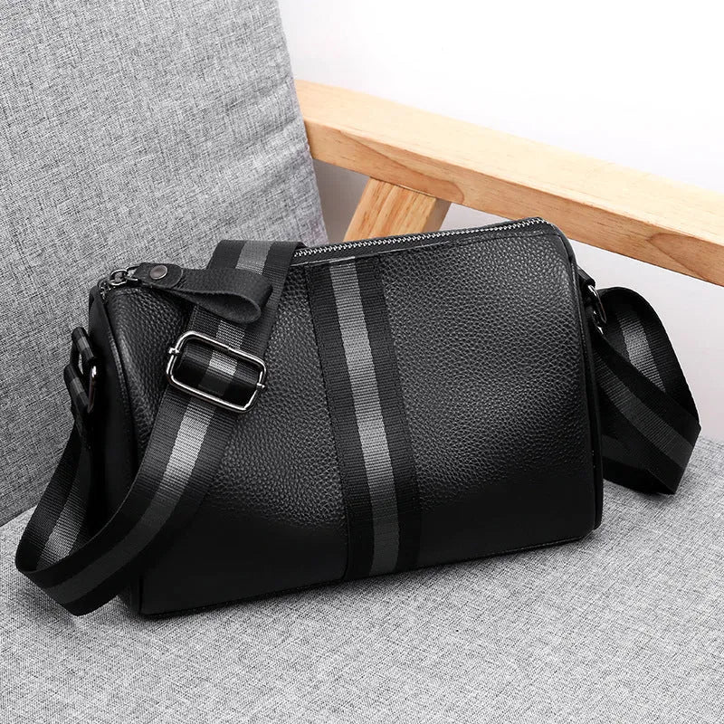 Black genuine leather one-shoulder crossbody bag with dimensions 24cm x 16cm x 13cm