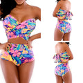 Red two-piece printed swimsuit with chest wrap top and pants on model