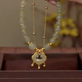Women's green safety lock bell pendant bracelet with electroplated mixed materials