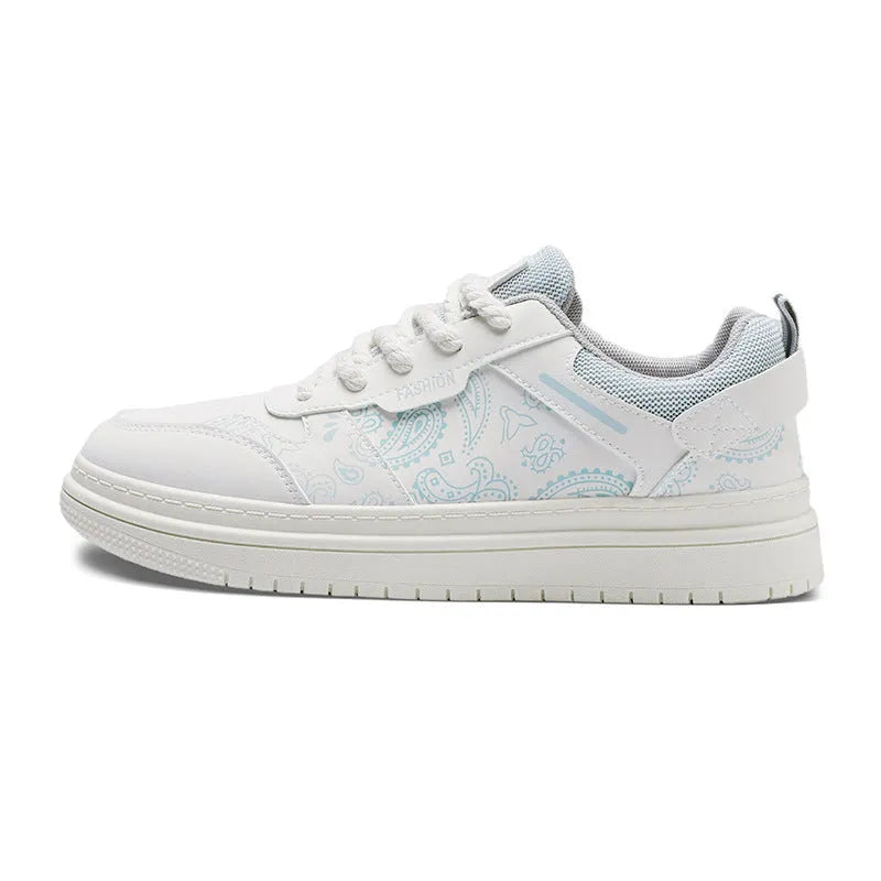 Low-top canvas board shoes with lace-up front, round toe, and flat rubber sole
