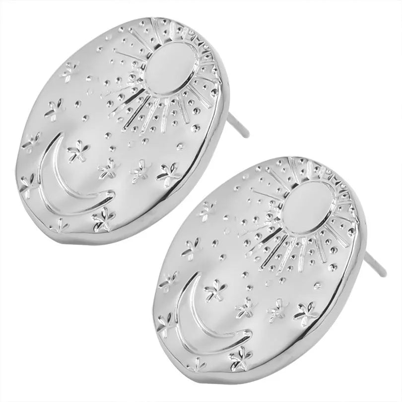 A pair of geometric shell design stud earrings in stainless steel, shown in gold and silver colours.