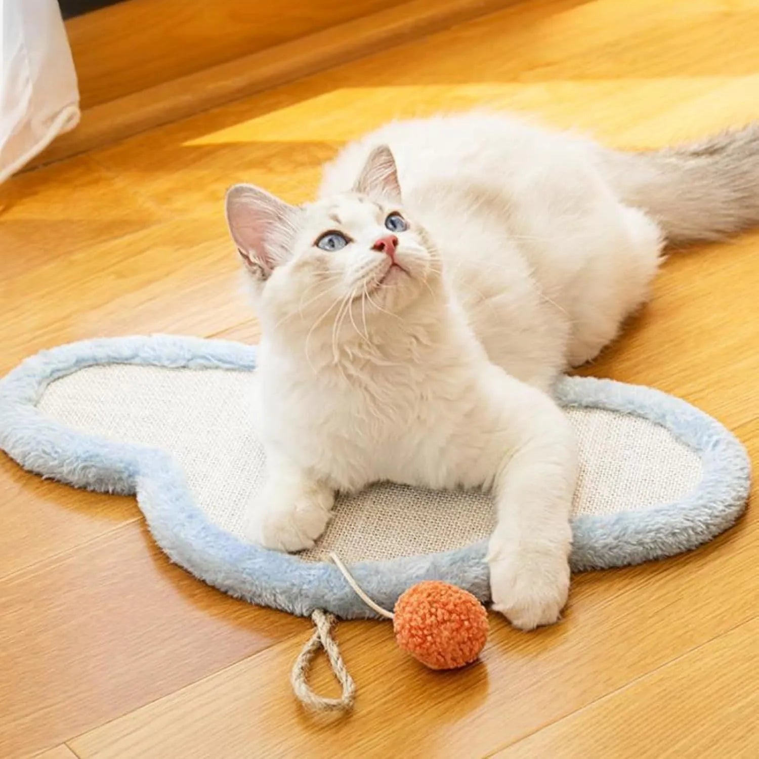 White cat scratching mat with cartoon cat design, made from natural sisal.