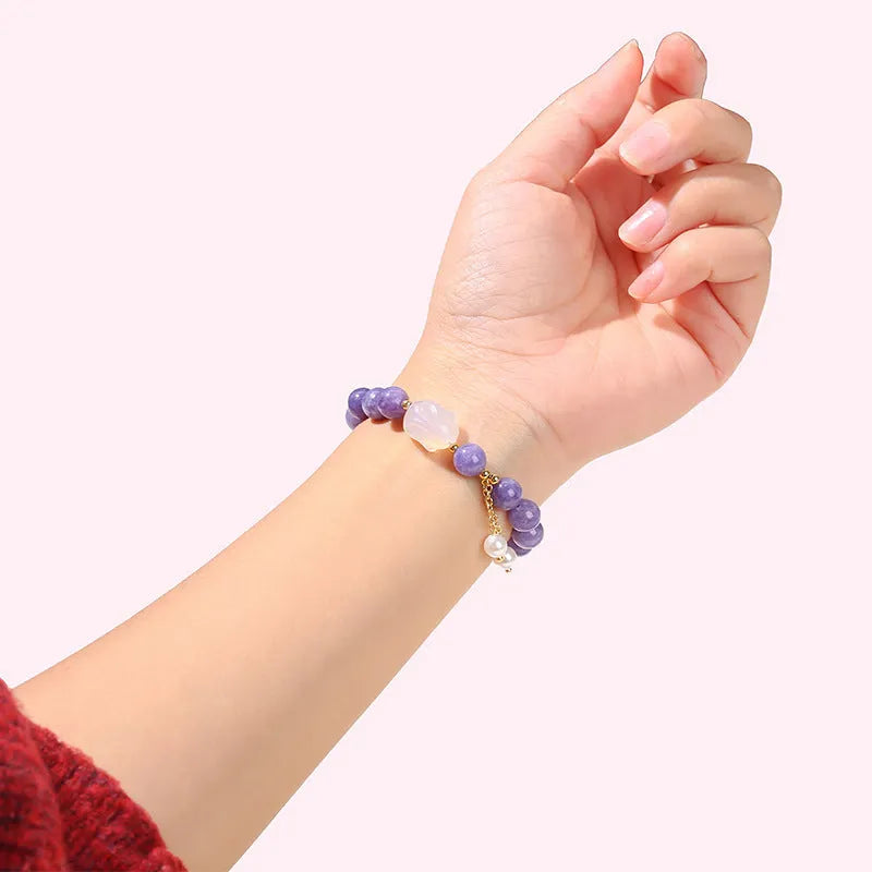 Purple aquamarine chalcedony and agate rabbit bracelet with geometric beads sized 6mm, 8mm, and 12 by 16mm.