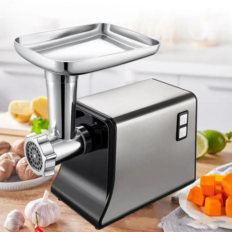 Silver meat grinder with double mixing blade, aluminium tray, and attachments on countertop