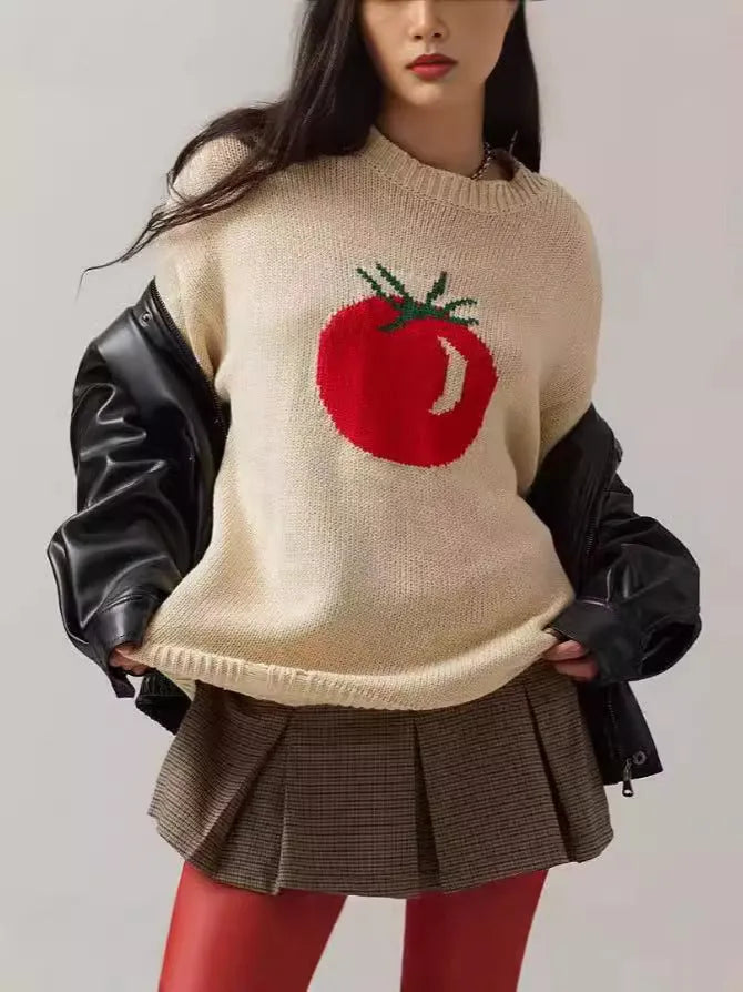Beige women's loose-fitting acrylic jacquard knit sweater with round neck and long sleeves.