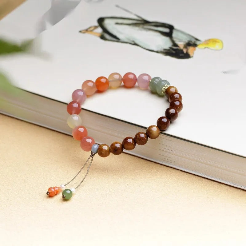 Handmade 8mm agate bracelet with diamond-shaped beads in natural persimmon colour tones