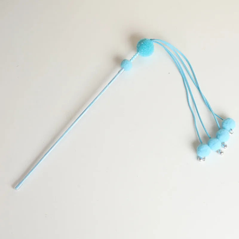 Colourful cat toy stick with a feather tassel on a foam handle in blue, pink, and purple options.