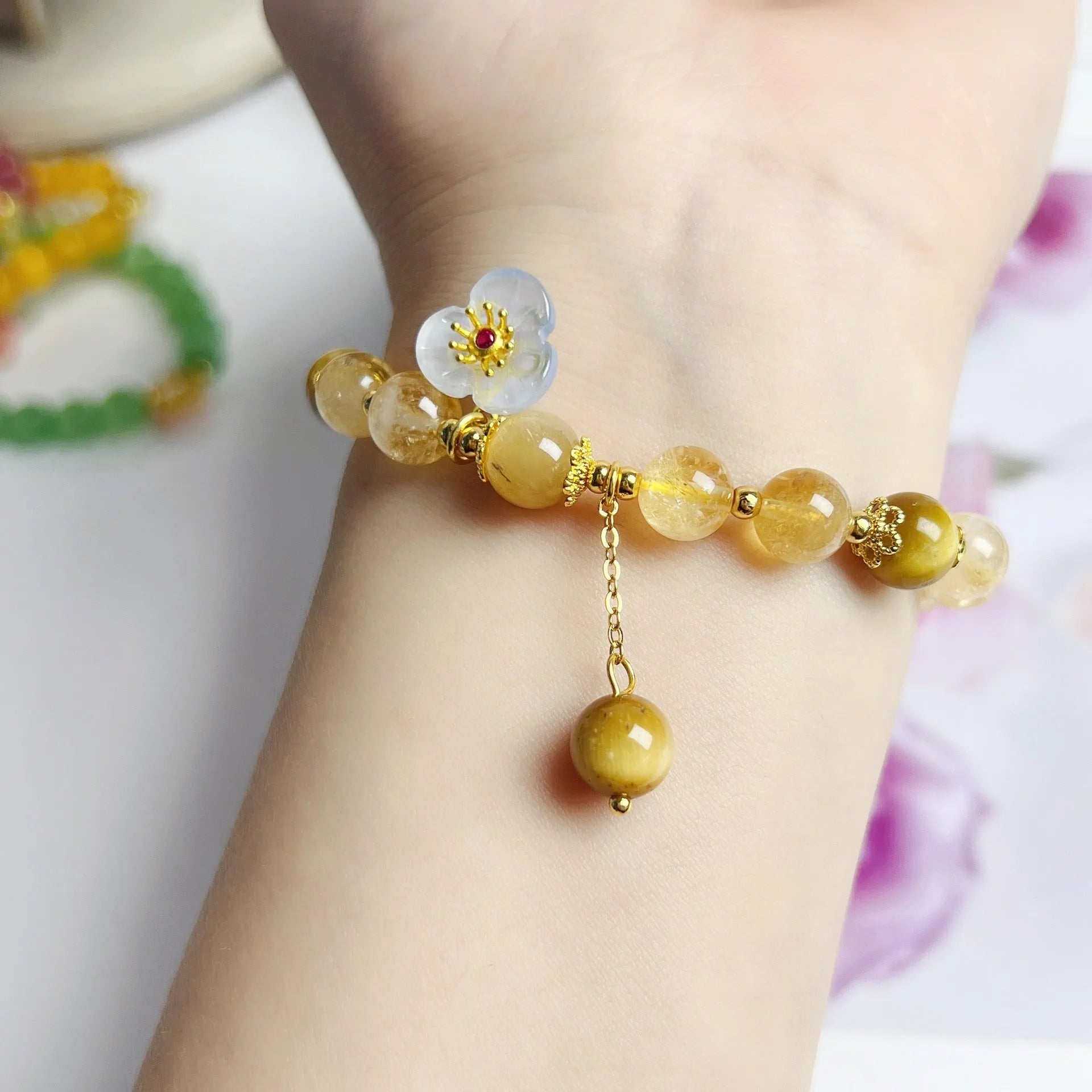 Handcrafted citrine crystal bracelet for women with a flower tassel in original design.