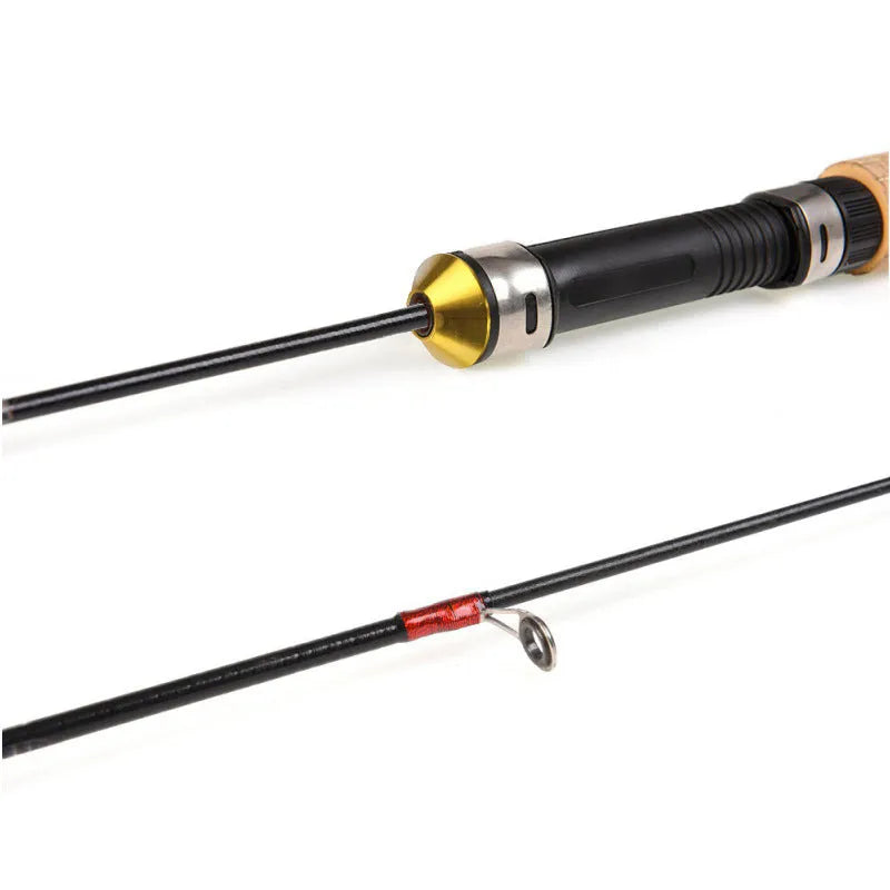 Wood grain ice fishing rod with carbon coating, retracted to 0.6 metres, shown on ice surface