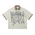 Men's loose blue cotton top with graffiti print and asymmetrical street style design.