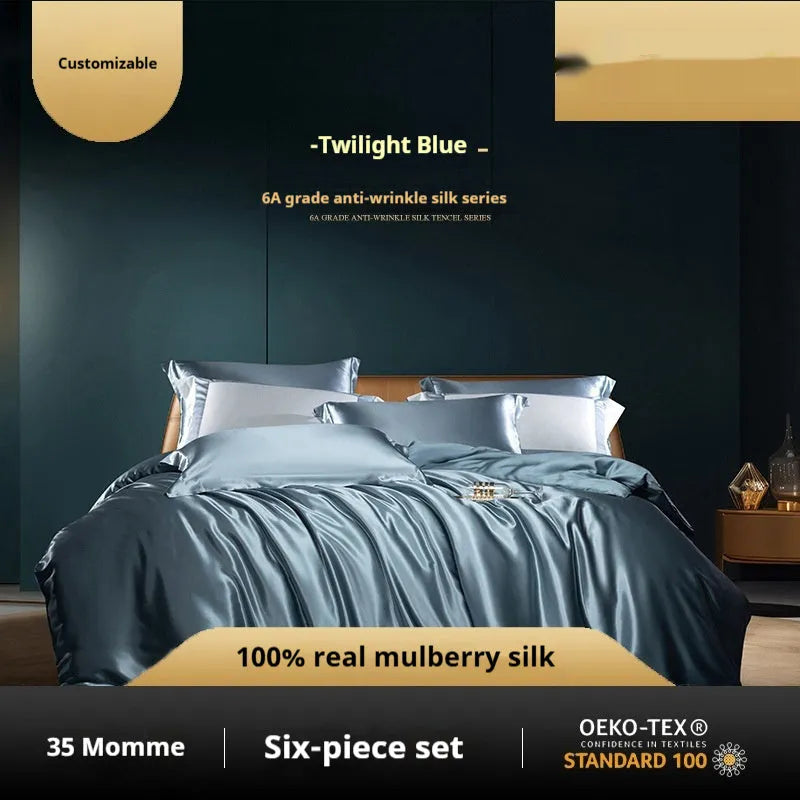 Household Fashion silk quilt cover set in Champagne Gold colour, showing quilt cover and pillowcases on a bed.