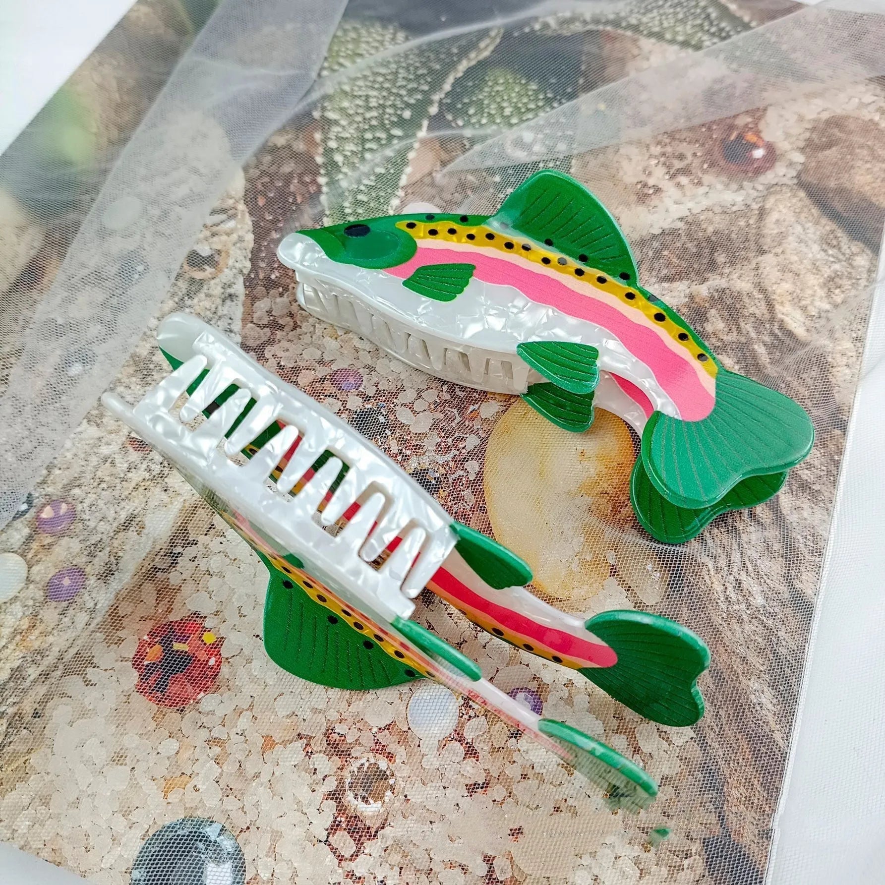 Dark green PVC hair clip featuring a printed rainbow trout and carp design.