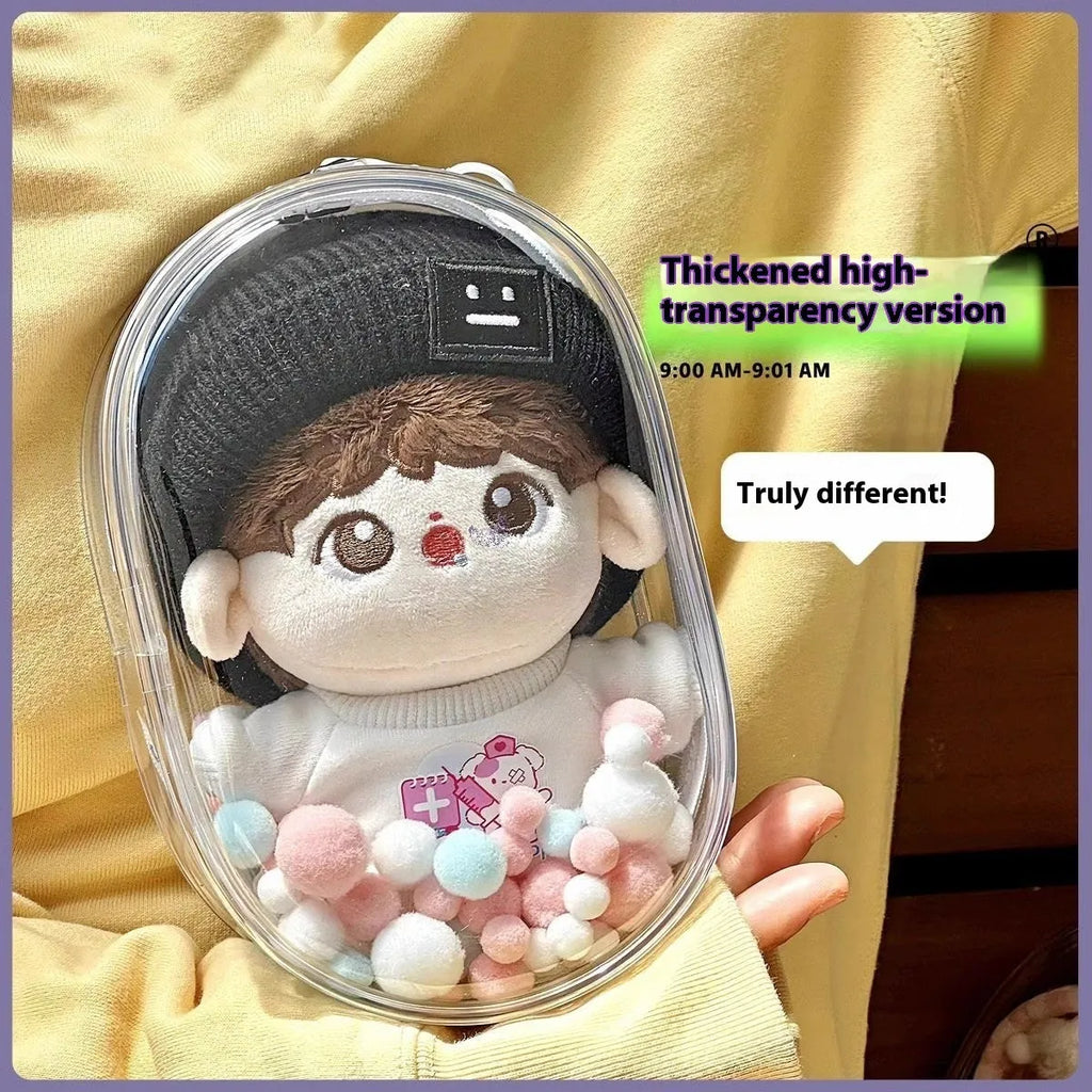 Transparent PVC cube storage bag with cartoon keychain and colourful ball in avocado green.