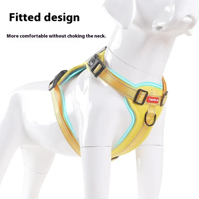 A black adjustable dog harness with a front chest D-ring, shown on a dog, demonstrating even strap placement.