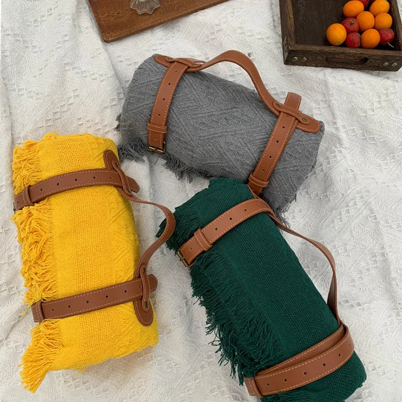 Chessboard plaid knitted picnic blanket with tassel edging and leather handle, acrylic camping rug