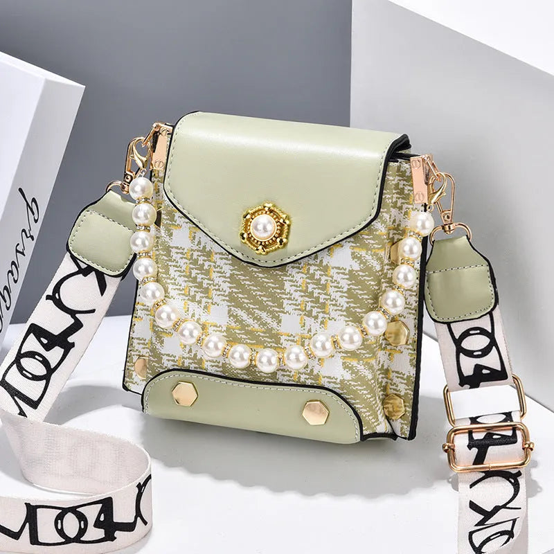 Women's crossbody phone bag in PU leather with pearl pendant and gold metal studs, magnetic flap closure