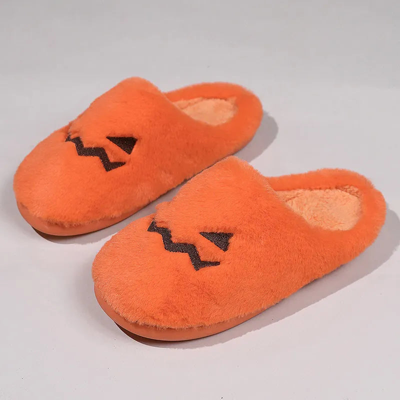 Orange women's Halloween pumpkin slippers with plush lining and a non-slip PVC sole