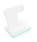 White three-in-one wireless charging station for phone, watch and headset on desktop