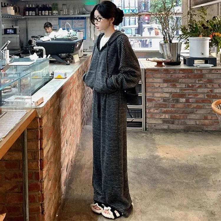 Two-piece sweatshirt and wide leg pants set in stripes or plaid pattern, conventional sleeves, sizes L to 4XL