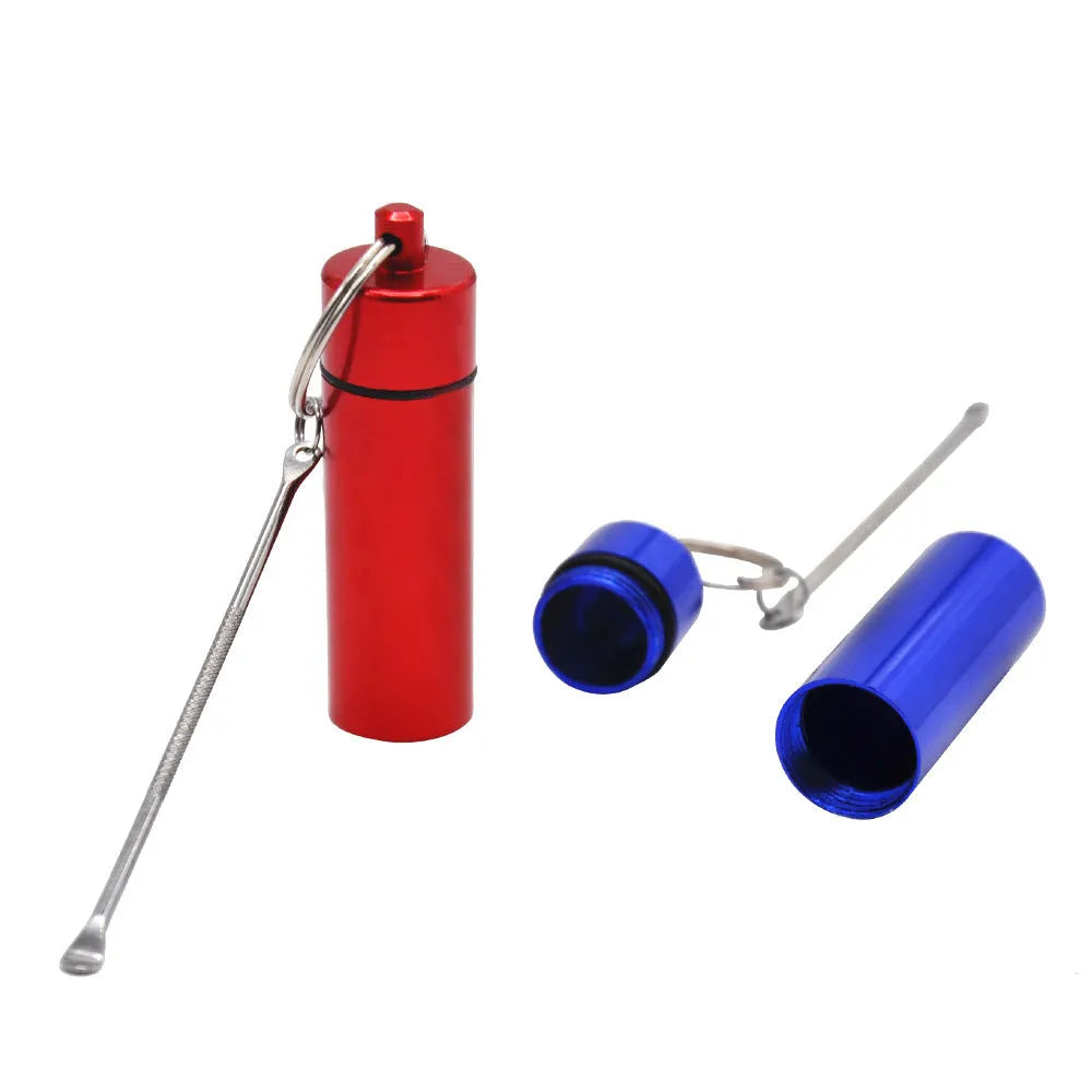 Small blue aluminium pill bottle with a silver spoon and keychain attached.