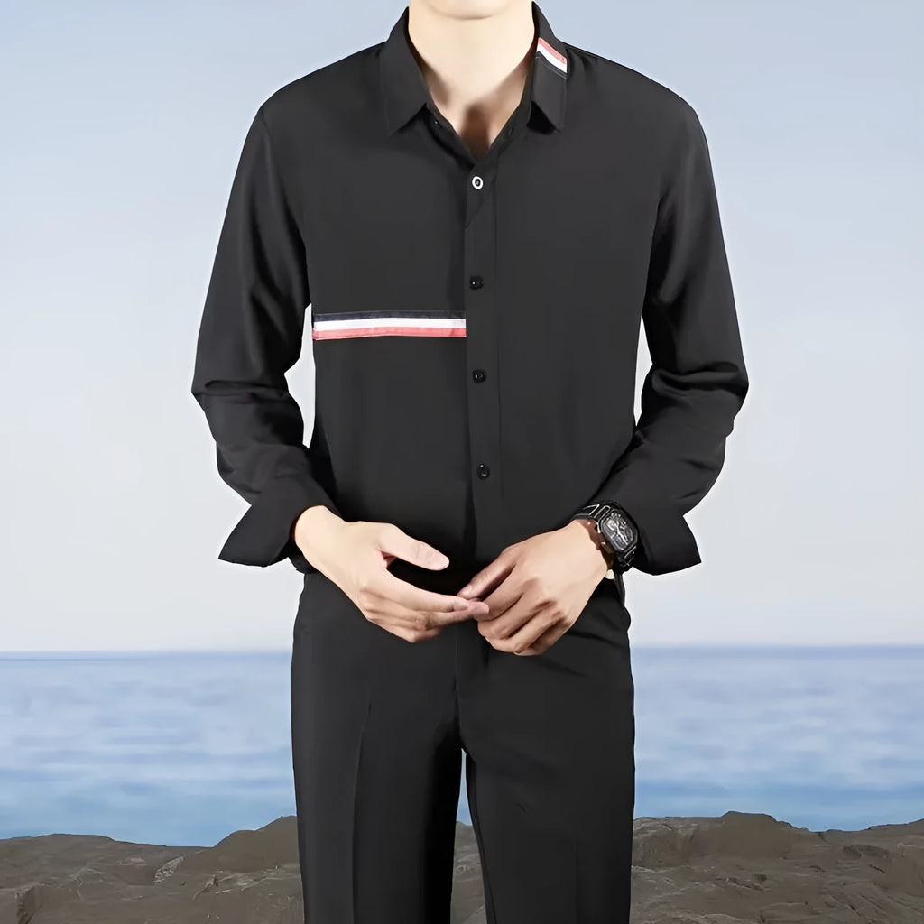 Man wearing a loose fit Hong Kong style casual shirt in a light blue cotton blend fabric.